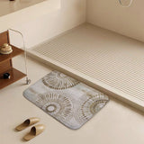 Coral velvet bath rug with gold mandala design in bathroom, non-slip and absorbent.