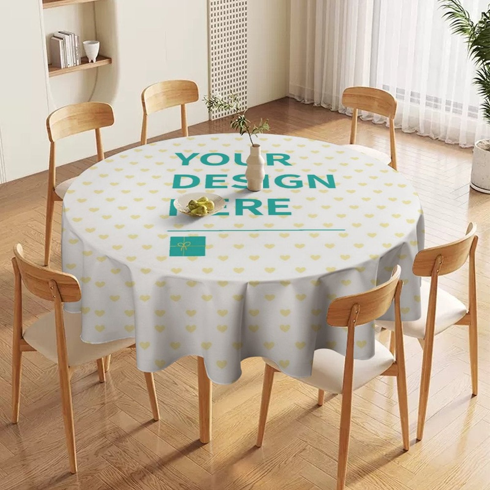 Customizable round tablecloth with heart pattern and 'YOUR DESIGN HERE' text, perfect for dining or events.