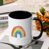 White ceramic mug with rainbow Pride design, black interior and handle, from MyArtsyGift, dishwasher and microwave safe.