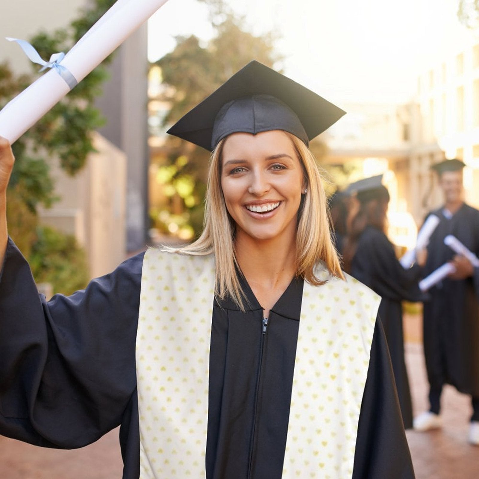 Smiling graduate with custom graduation stole and diploma, perfect senior gift for graduation.