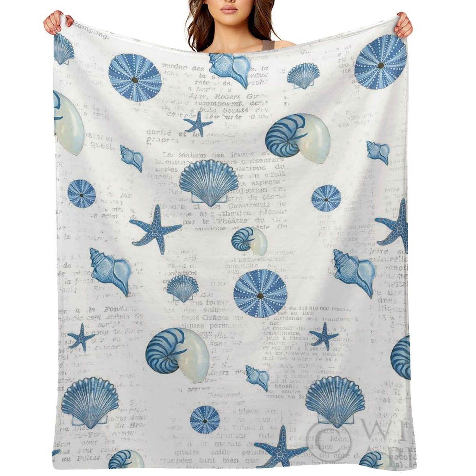 Navy shells pattern fleece blanket featuring blue seashells and starfish, soft and cozy for bed or sofa