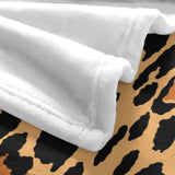 Soft white flannel blanket with leopard print design; a cozy and warm home decor blanket.