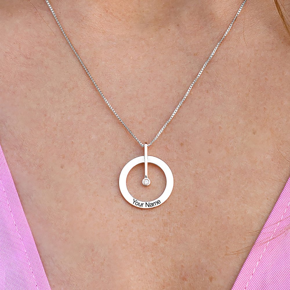 Personalized silver circle necklace for women, diamond pendant, custom engraved text 'Your Name', on a silver chain.