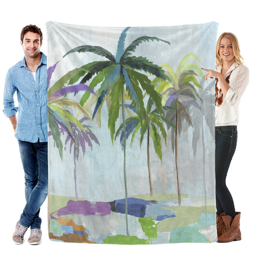 Abstract coconut palm trees flannel blanket held by two people. Made in USA.