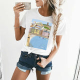 Women's white crewneck t-shirt with a coastal town graphic print, perfect for MyArtsyGift shoppers.