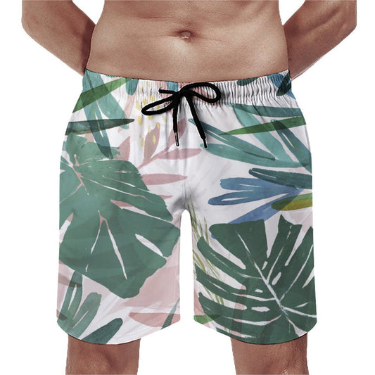 Men's Hawaiian swim shorts with monstera leaf print. Quick-drying, mesh-lined beach board shorts.