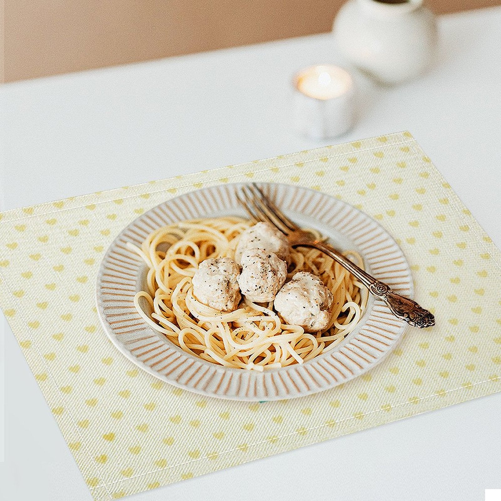 Custom linen placemat with heart pattern, dining table decor with spaghetti and meatballs, flax placemat