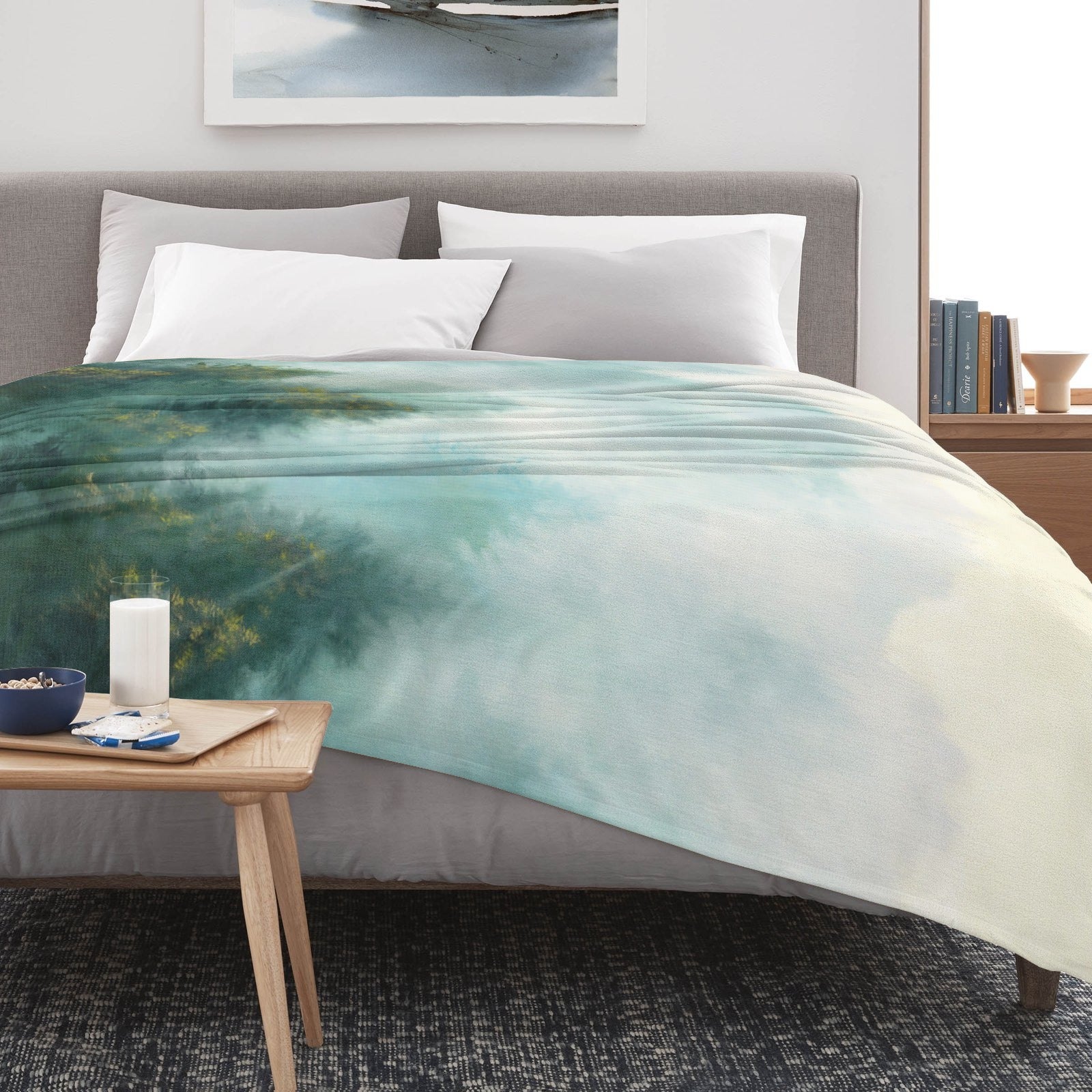 Misty Forest Flannel Blanket on bed, soft USA-made forest print for cozy indoor/outdoor use