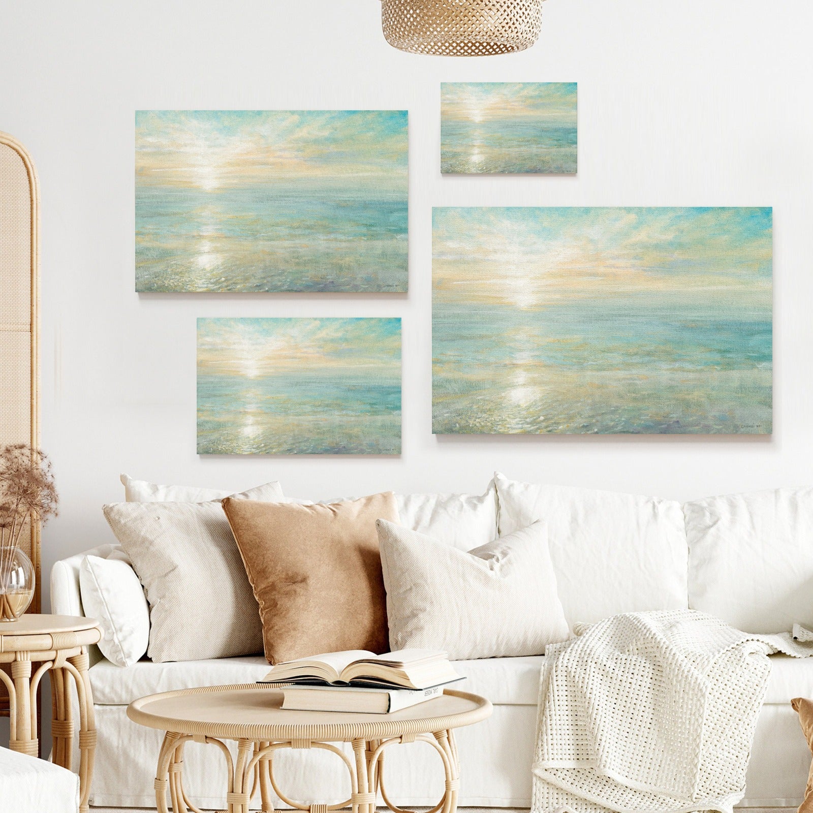 Sunrise canvas print set for wall decor with soft colors, made in the USA. Ocean scenery art above white sofa.