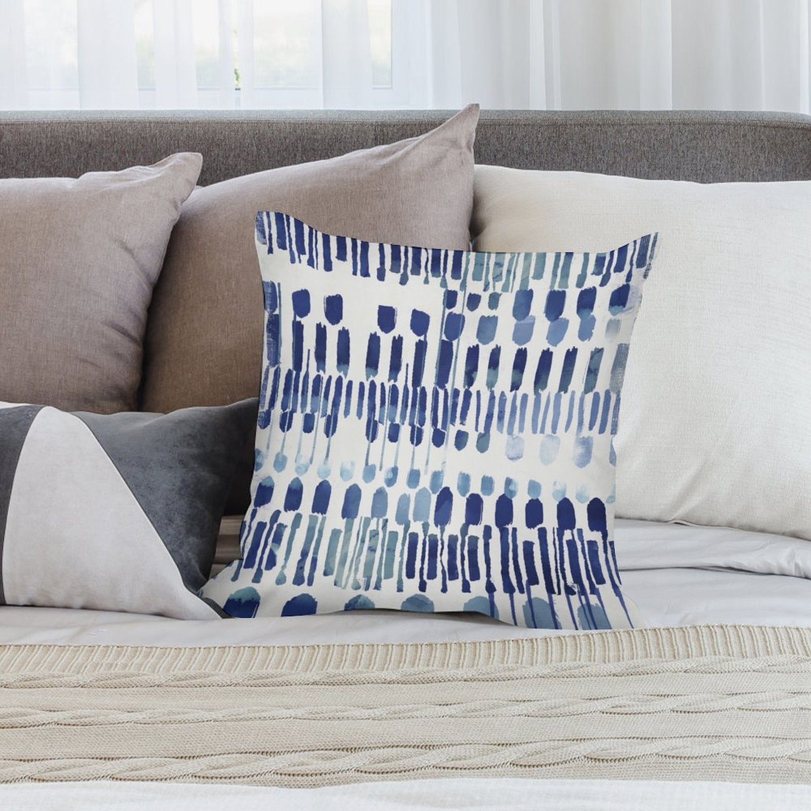 Abstract blue pillow cover for sofa decor. Soft plush material and decorative design for living room.