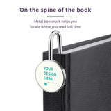 Custom metal bookmark on book spine, personalized design area, ideal gift for book lovers.