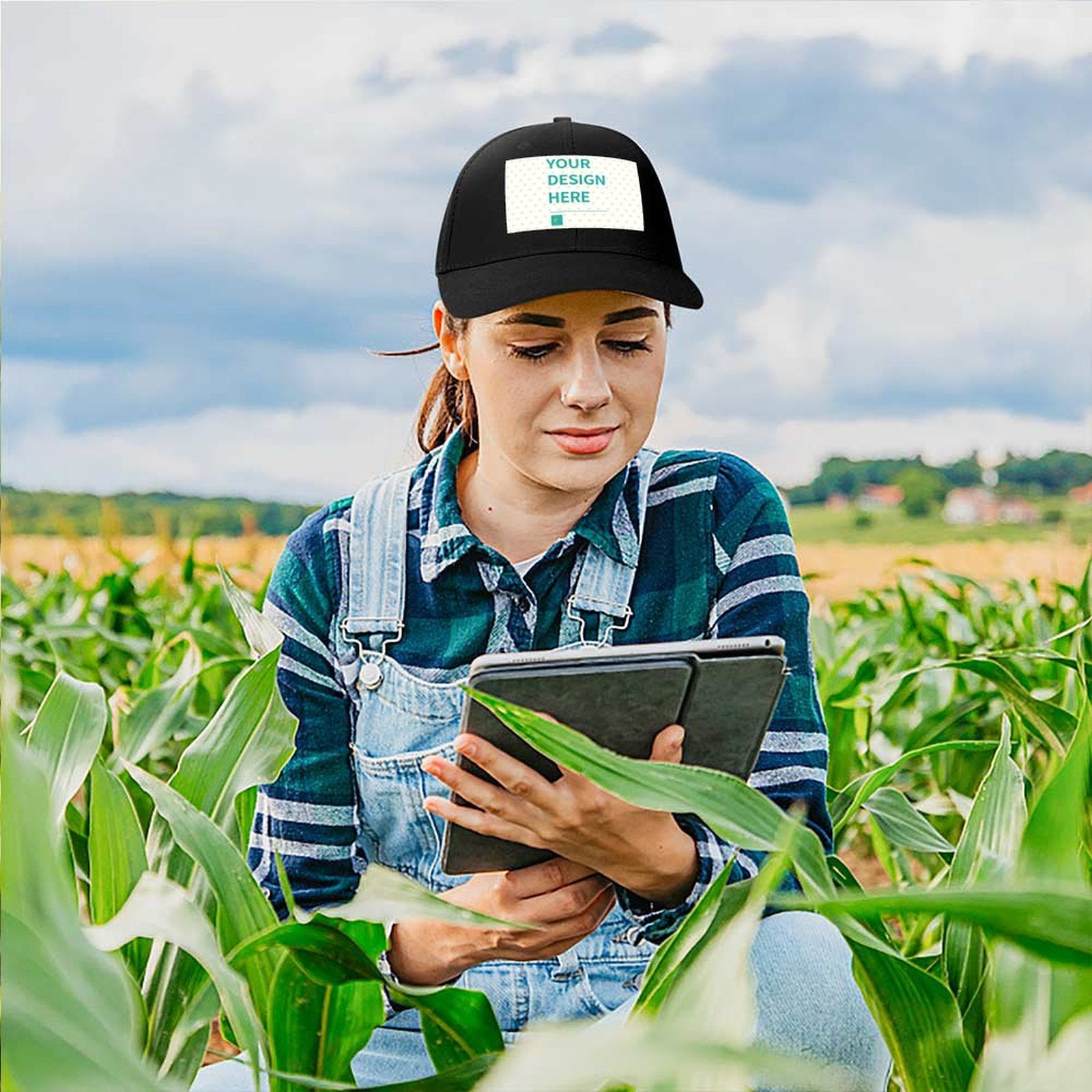 Customizable black baseball cap with 'YOUR DESIGN HERE' design, for men & women, comfortable and adjustable fit.