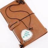 Personalized crystal car pendant with custom design area, glass heart shape, Chinese knot, tassel, and brown leather journal.