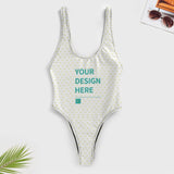Customizable one-piece swimsuit for women with heart pattern, featuring 'YOUR DESIGN HERE'. Personalized swimwear.