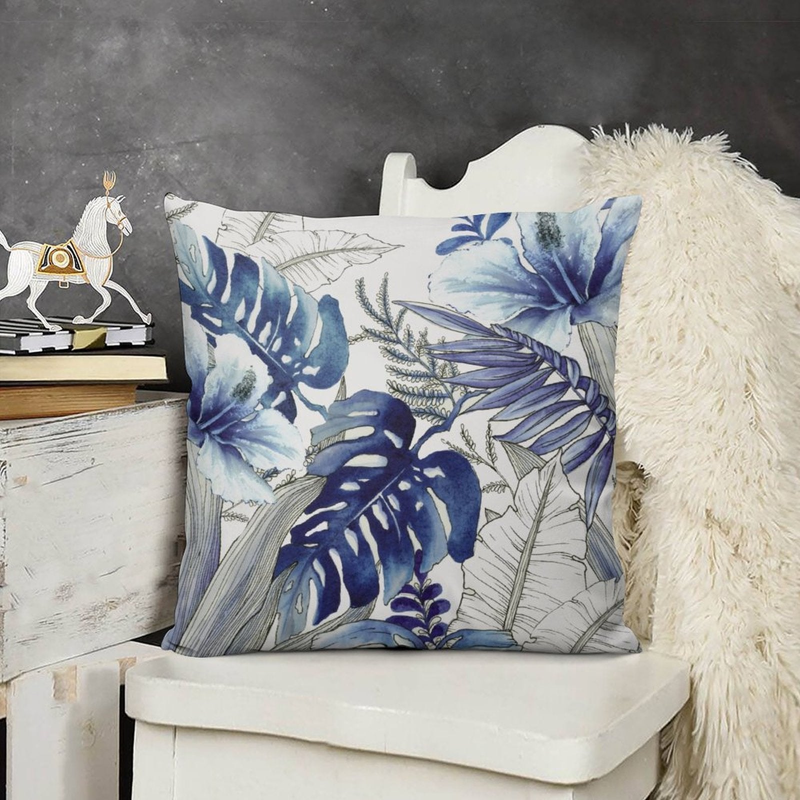 Blue floral plush pillow cover for sofa. Soft, fluffy, and decorative tropical leaf design, perfect for living room decor.