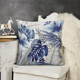 Blue floral plush pillow cover for sofa. Soft, fluffy, and decorative tropical leaf design, perfect for living room decor.