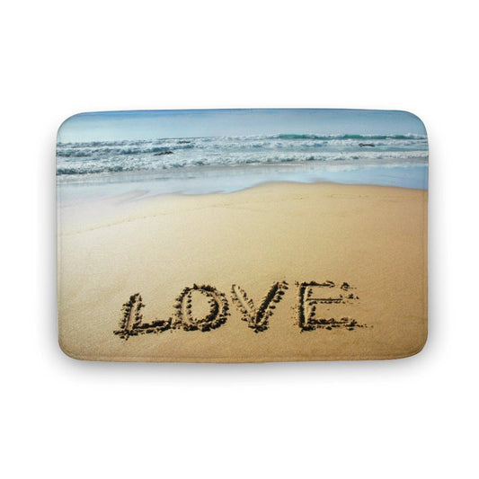 Coral velvet bath rug with a beach scene that says LOVE, non-slip and quick-drying.