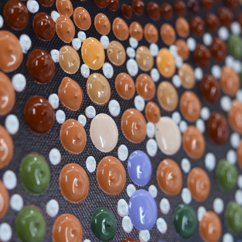 Close-up of handmade mosaic artwork. Featuring colorful paint dots on linen canvas by Ben Heine, wall art.