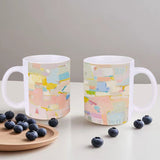 White ceramic mug with colorful abstract art design with 'WILD' text, perfect gift with blueberries