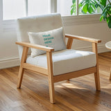 Custom throw pillow with 'YOUR DESIGN HERE' on a wooden armchair. Perfect for living room decor, personalized gifts.