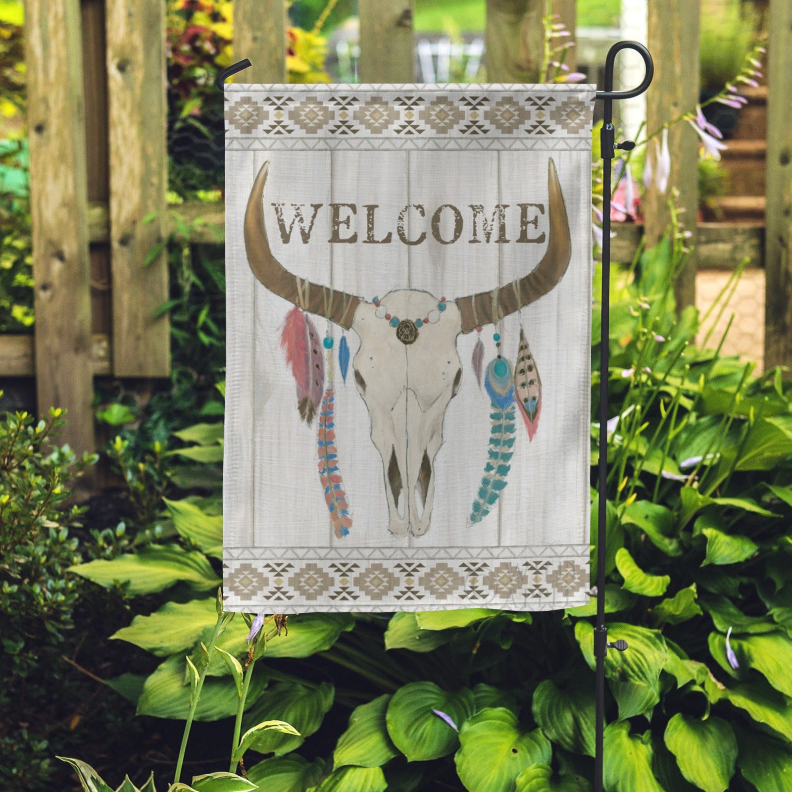 Welcome garden flag with bull skull and feather design, for yard or farmhouse decor.