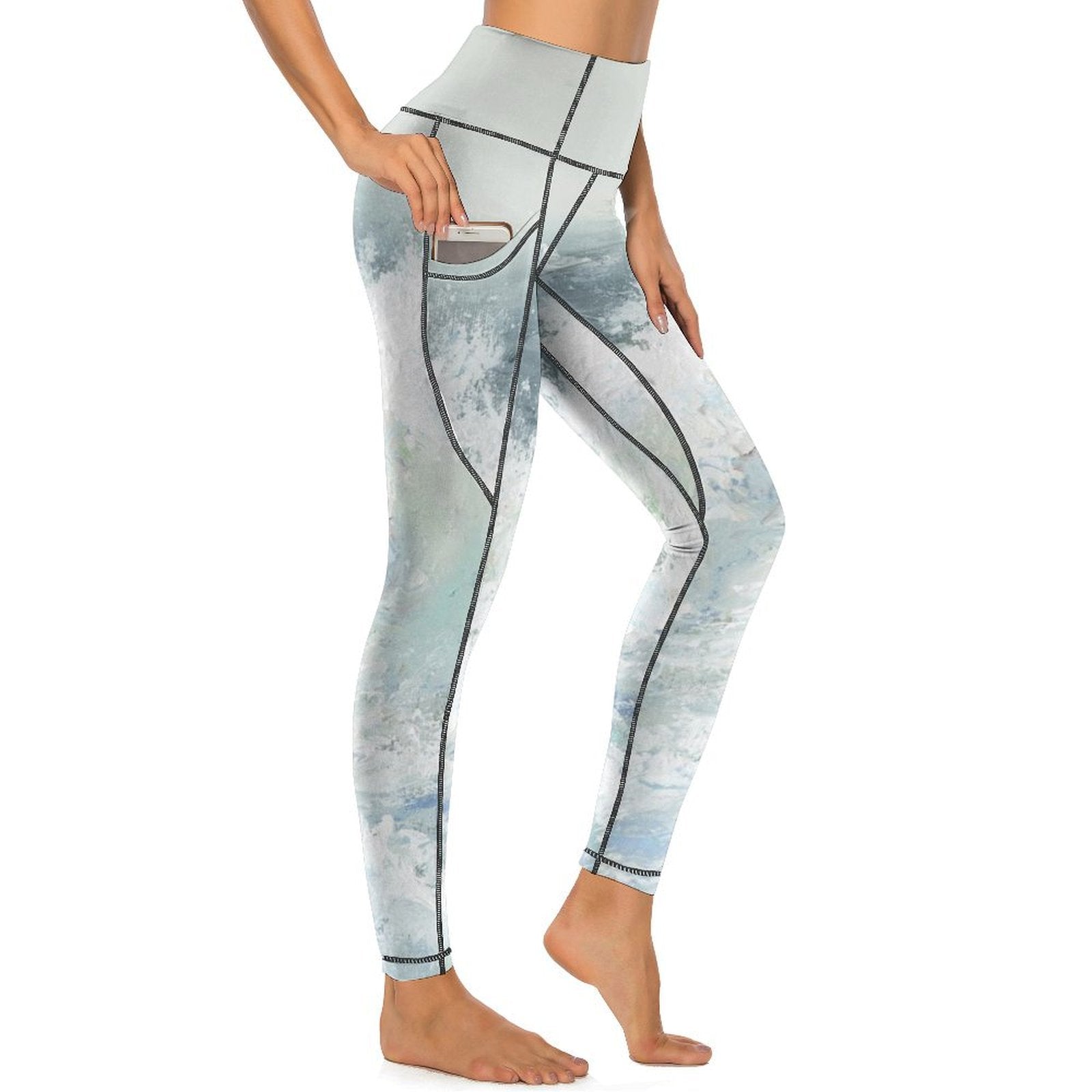 High-waisted yoga leggings with pockets and artistic watercolor design; perfect for yoga and workouts.