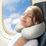 U-shaped travel pillow on plane, memory foam, white with yellow dots, for travel comfort and neck support