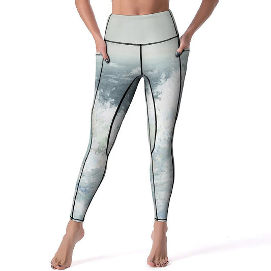 High-waisted yoga pants with pockets, artistic wave design, perfect for yoga or workout.