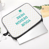 Custom laptop sleeve with 'YOUR DESIGN HERE' design, snowflake fabric, and laptop inside, personalized laptop bag