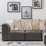 Cotton Linen Pillow Case Set of 4 with Christmas designs, gold snowflake, trees, and deer on sofa.