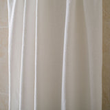 White polyester beach towel, soft and absorbent, ideal for swimming, camping or seaside use, shown folded