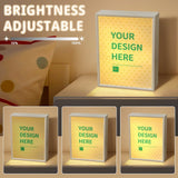 Personalized LED mirror with 'YOUR DESIGN HERE' text and adjustable brightness, a customizable gift for any room.