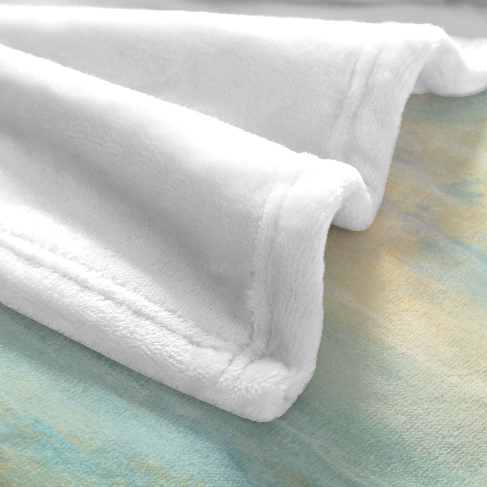 White polyester flannel blanket with beach sunrise background, perfect for cozy home decor