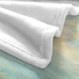 White polyester flannel blanket with beach sunrise background, perfect for cozy home decor