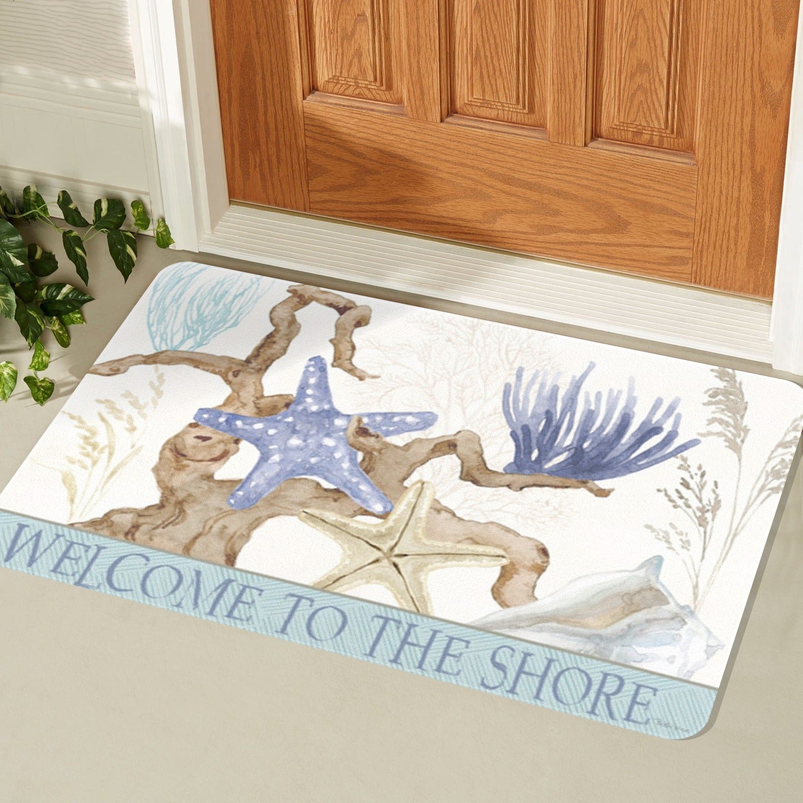 Welcome doormat with beach design, featuring starfish, coral, and welcome text, for home entrance