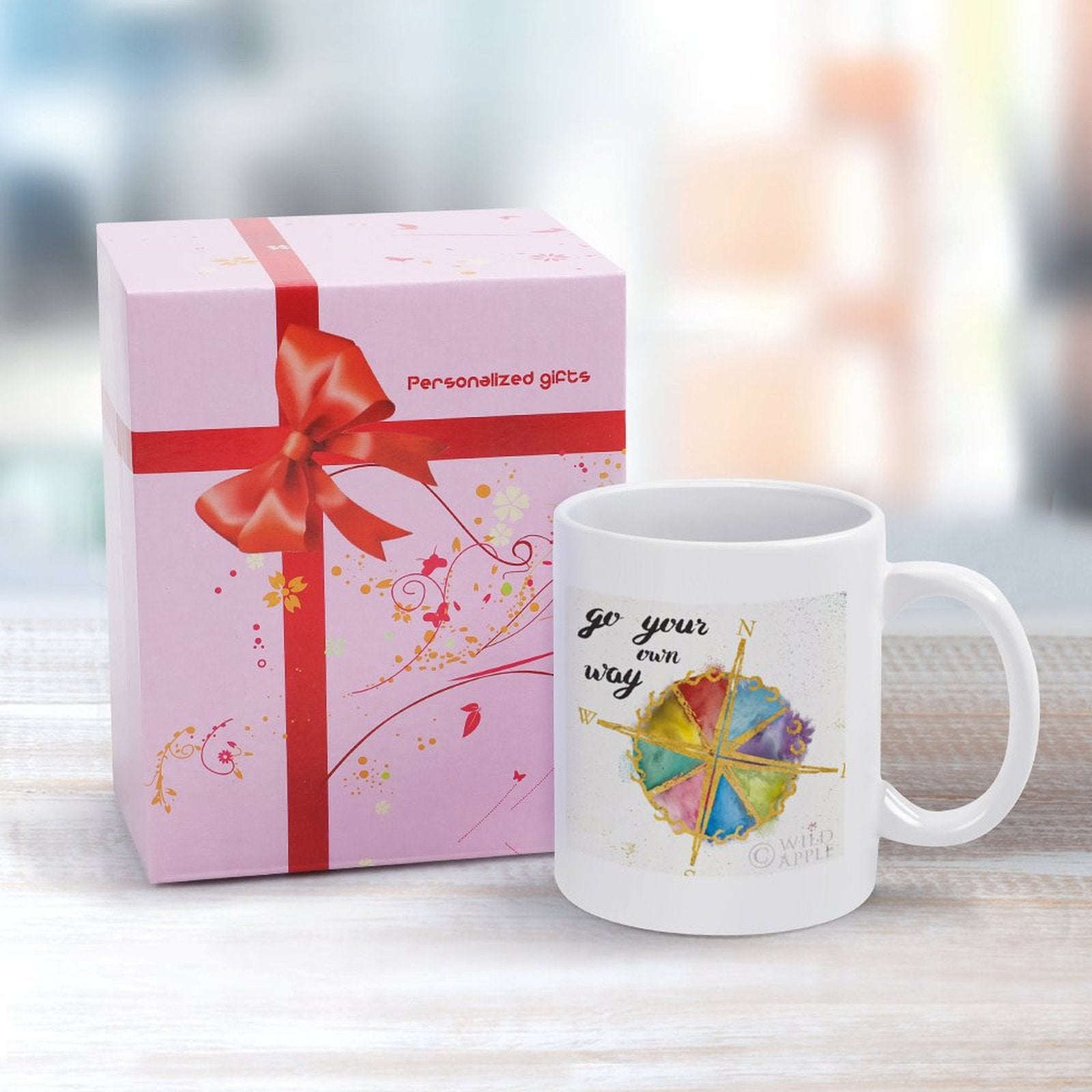 White ceramic mug with "Go Your Own Way" art and compass rose, a personalized gift for home or office