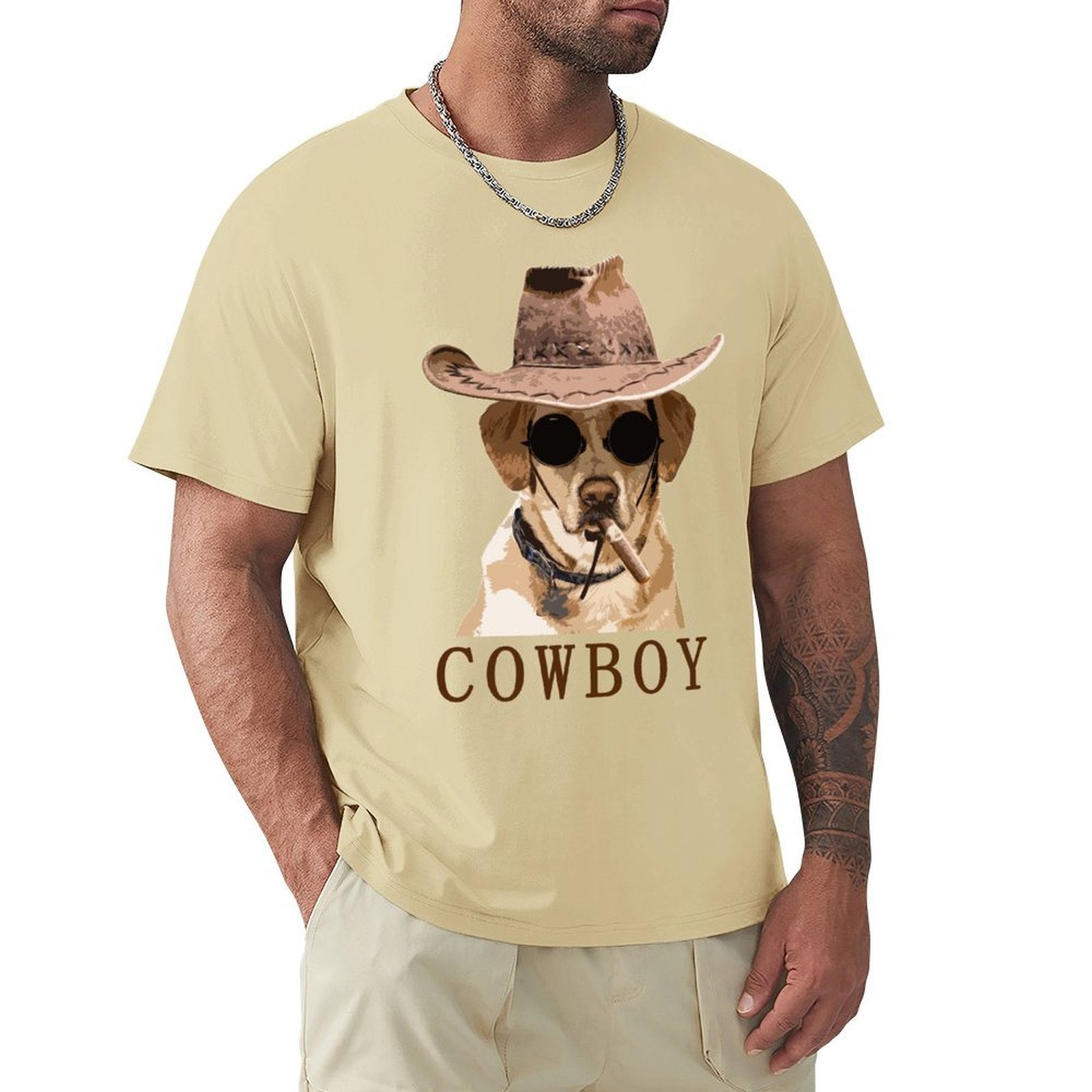 Men's crew neck t-shirt with a cowboy dog graphic in light tan color, breathable cotton fabric.