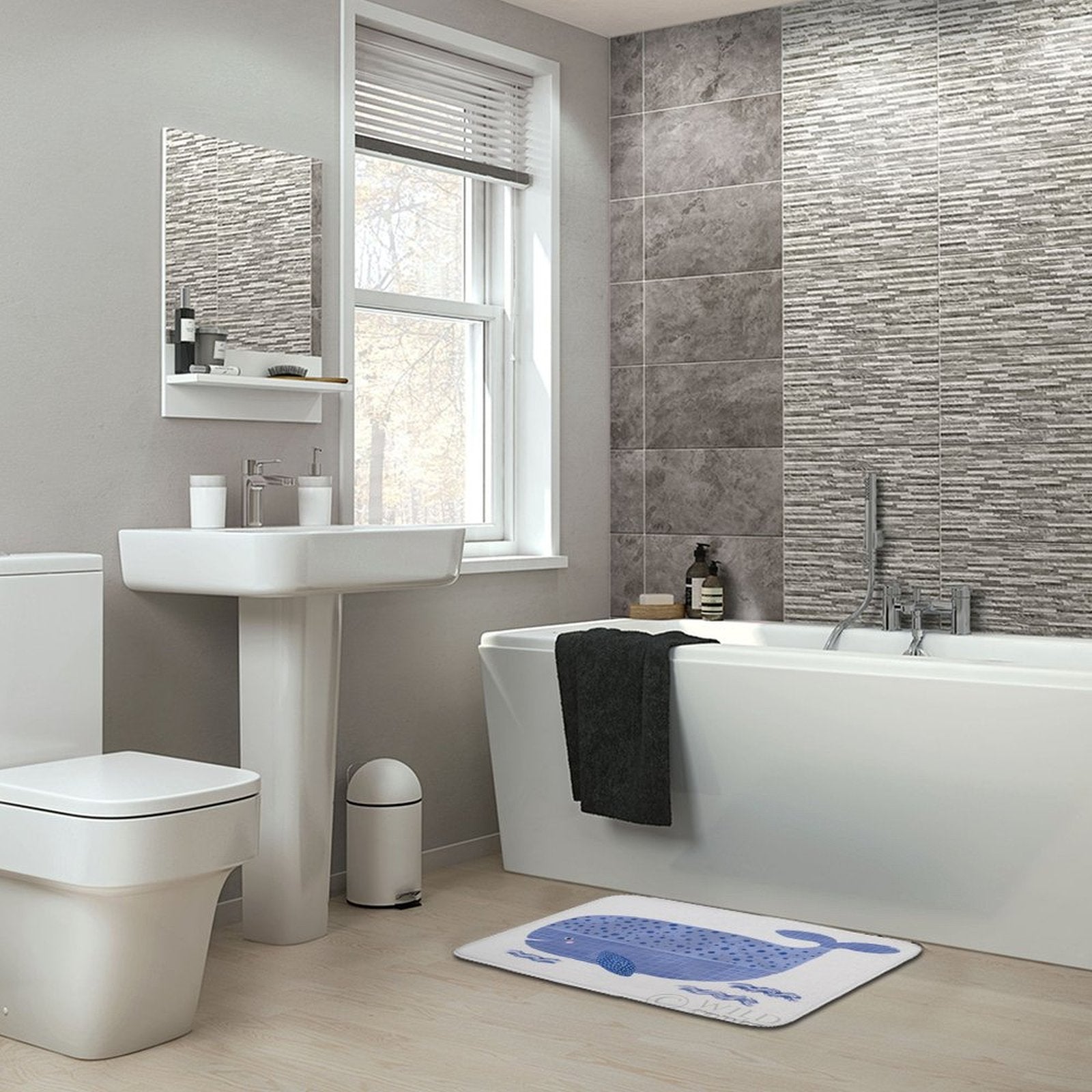 Blue whale design coral velvet bath rug in modern bathroom. Non-slip, absorbent rug for bathroom or kitchen