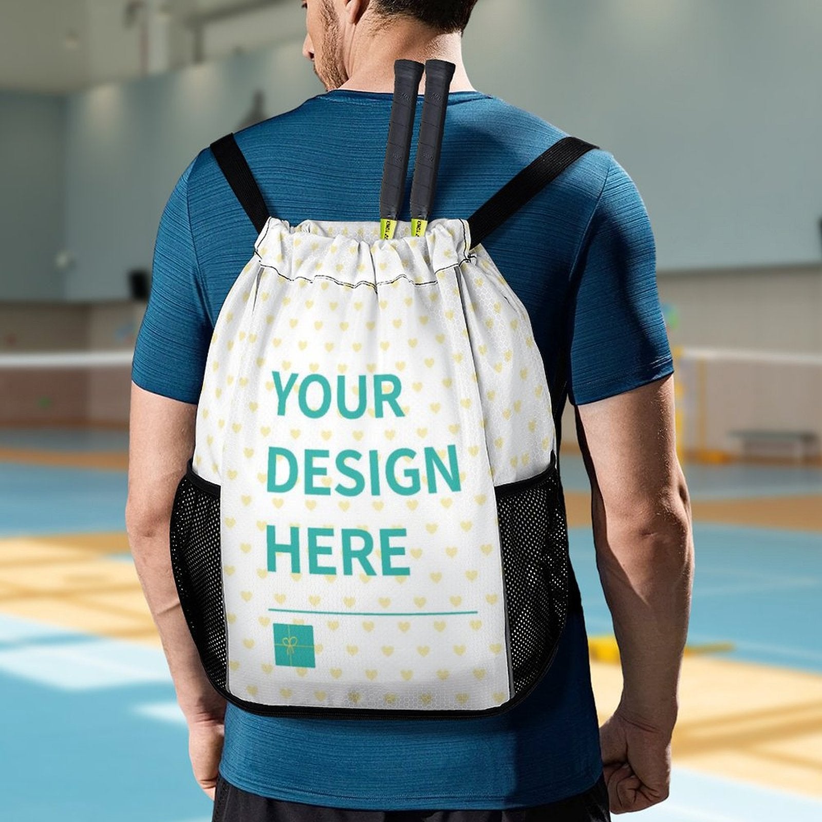 Custom drawstring gym backpack with 'YOUR DESIGN HERE' design, honeycomb fabric, for travel and sport, with tennis rackets.