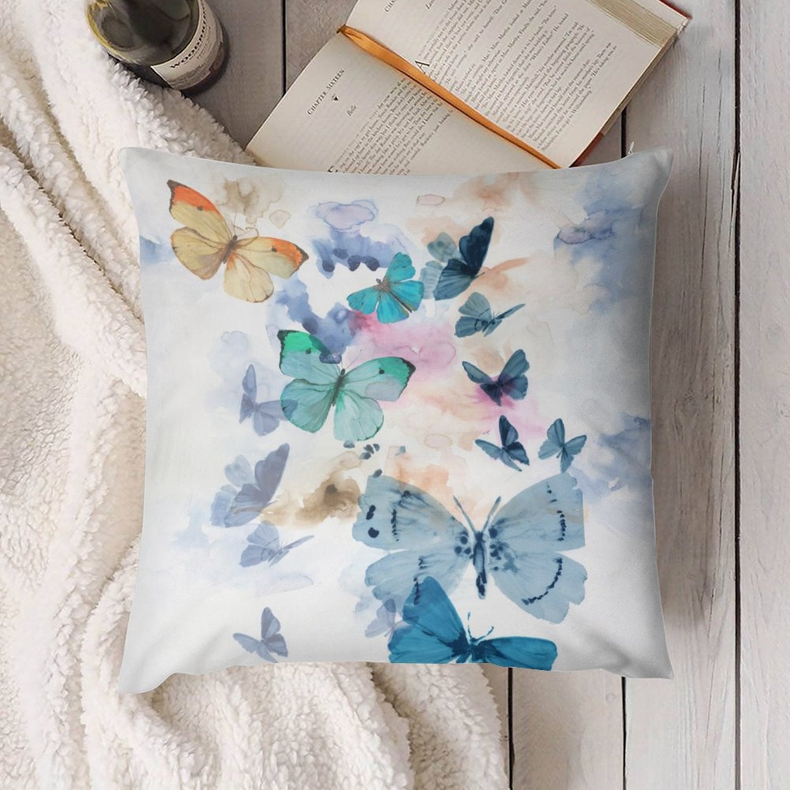 Butterfly pillow cover for sofa decor. Soft plush with watercolor butterflies in shades of blue, turquoise and orange.