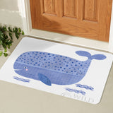 Blue whale entrance doormat for home. Decorative whale illustration on white rug.