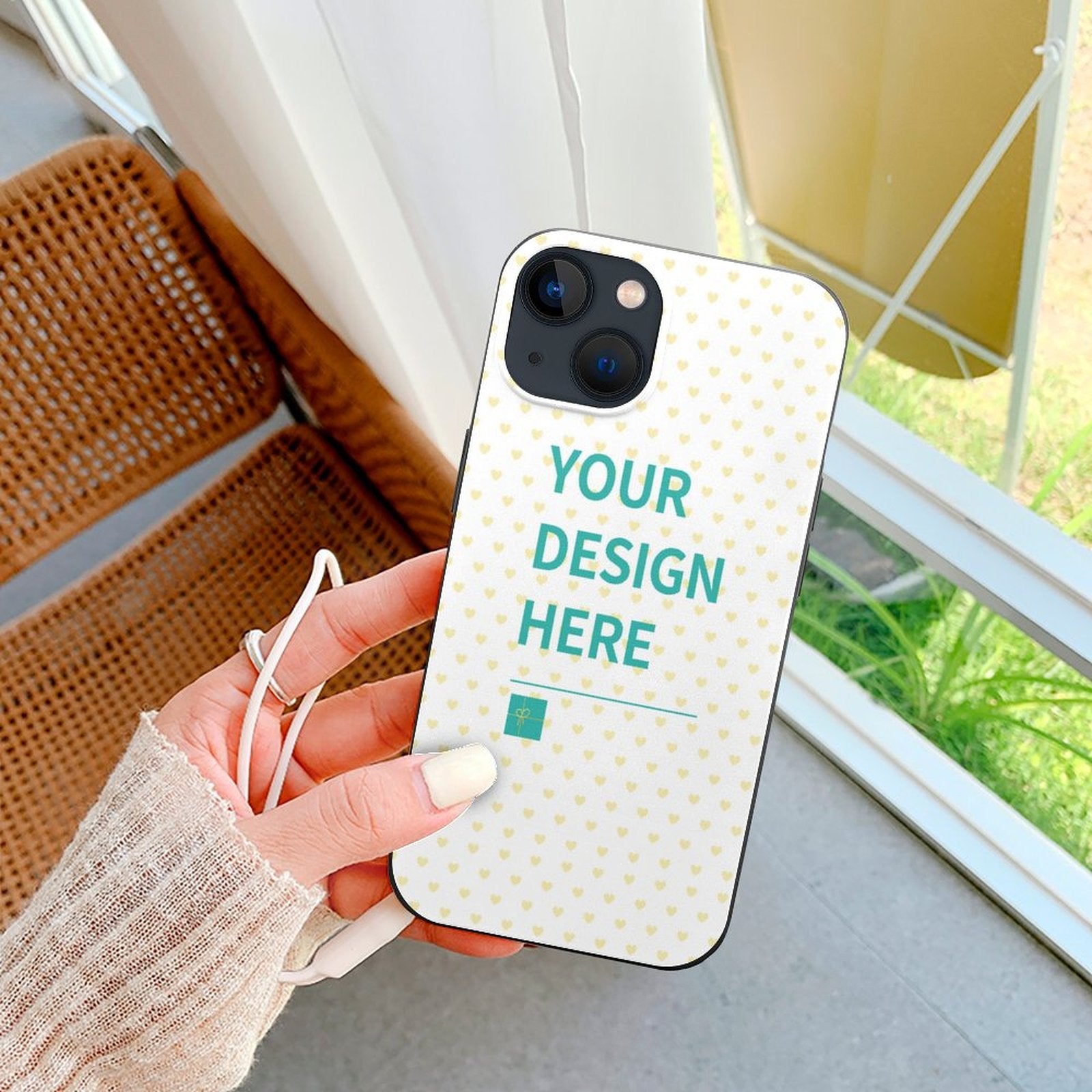 Custom iPhone 13 case with 'YOUR DESIGN HERE' text and heart pattern, TPU material