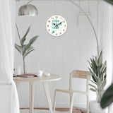 Personalized round wooden wall clock with 'YOUR DESIGN HERE' text on white wall; ideal for home decor and housewarming gift.