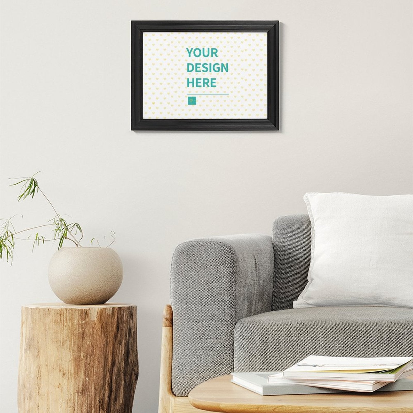 Custom canvas print with 'YOUR DESIGN HERE' text, black frame, personalized wall art.