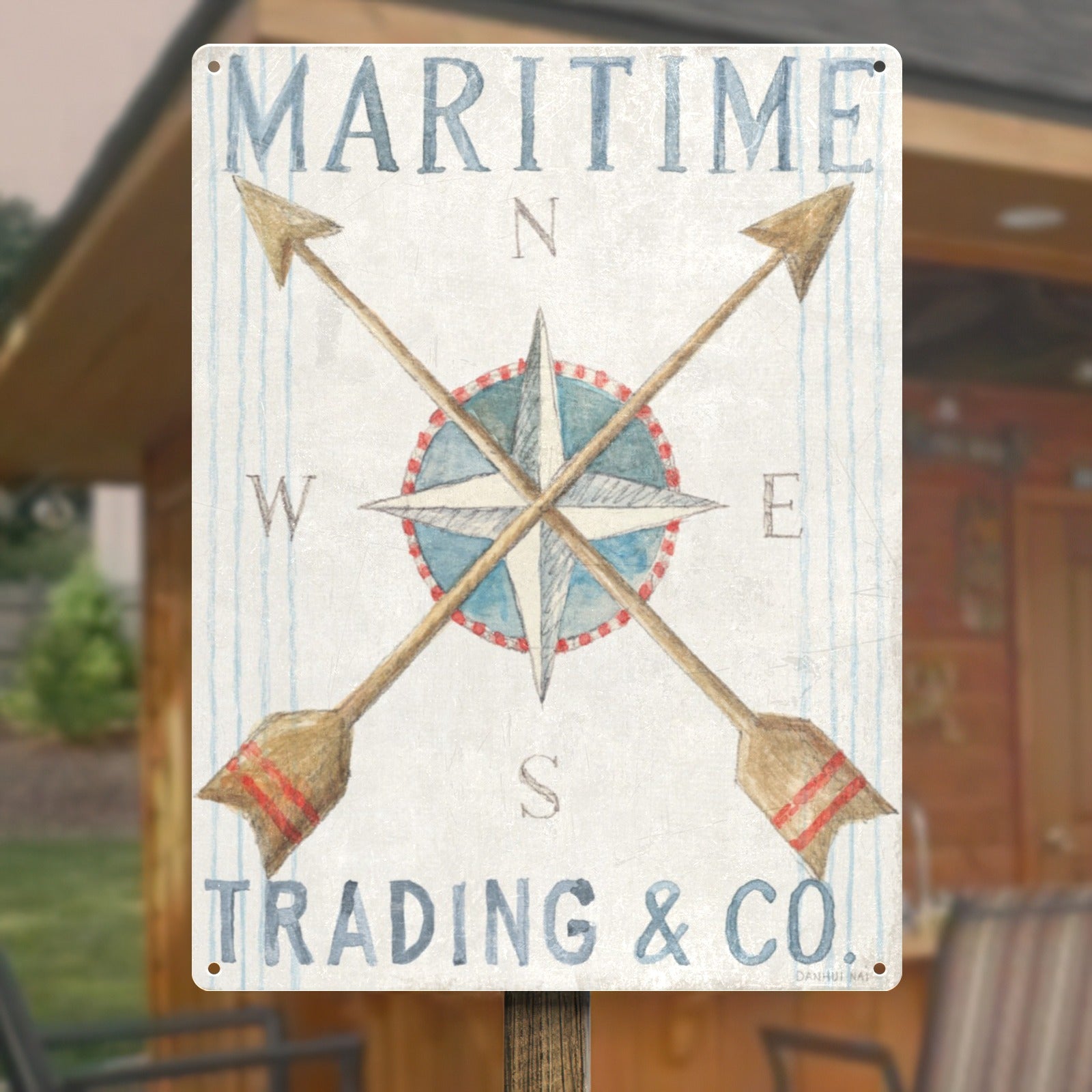 Retro nautical metal sign with compass design, "MARITIME TRADING & CO." on white iron plate.