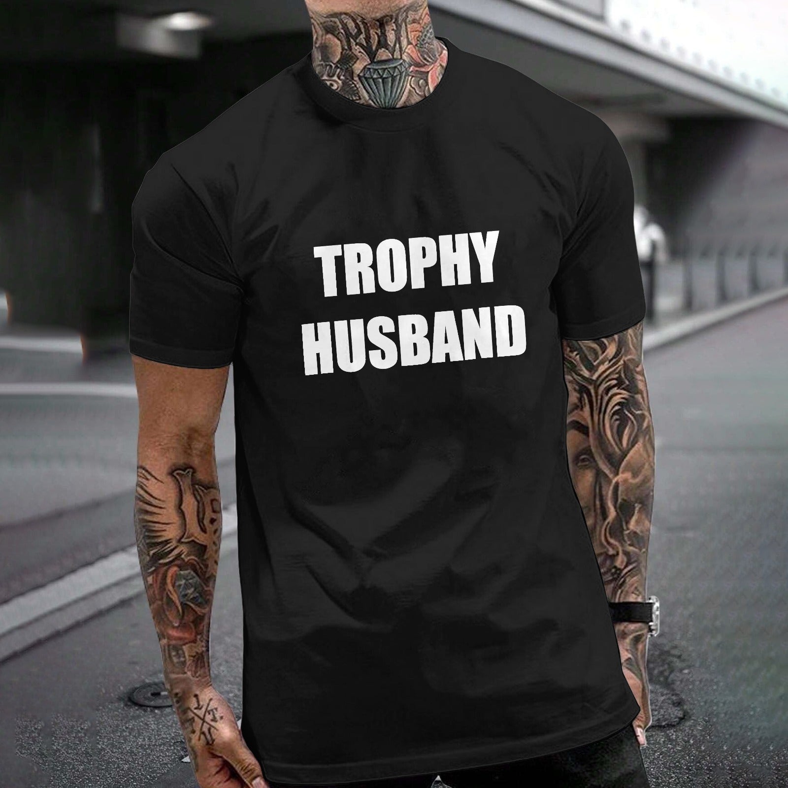 Black Gildan T-shirt with TROPHY HUSBAND print for expressing individuality; unisex cotton tee