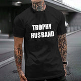 Black Gildan T-shirt with TROPHY HUSBAND print for expressing individuality; unisex cotton tee