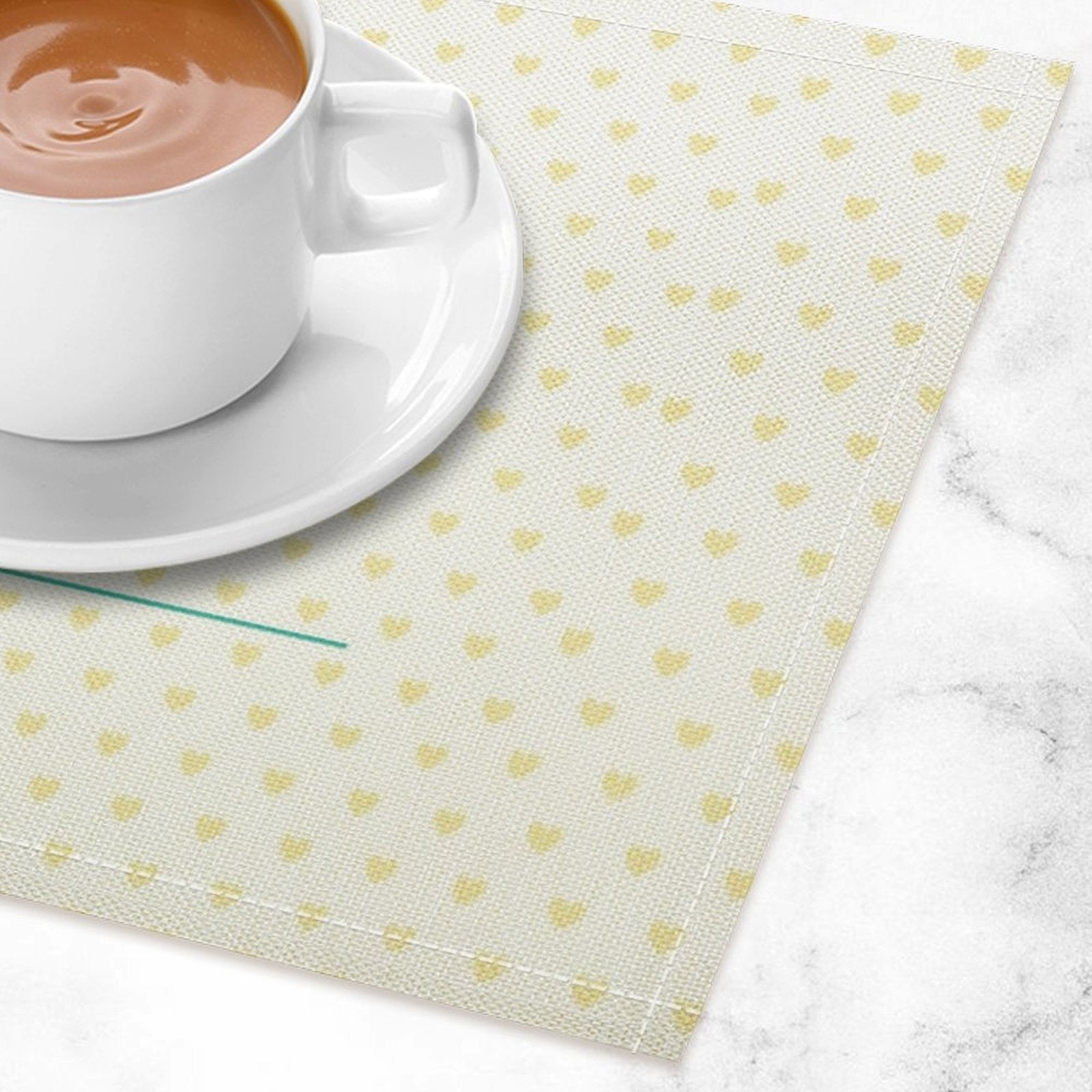 Flax placemat with heart pattern under coffee cup, dining table decor