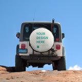 Custom tire cover with 'YOUR DESIGN HERE' design on a white SUV, Oxford cloth, suitable for all vehicles