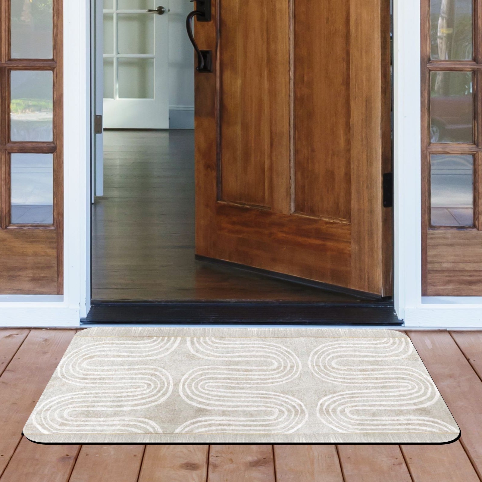 Beige rubber doormat with white wave pattern in front of wooden door.